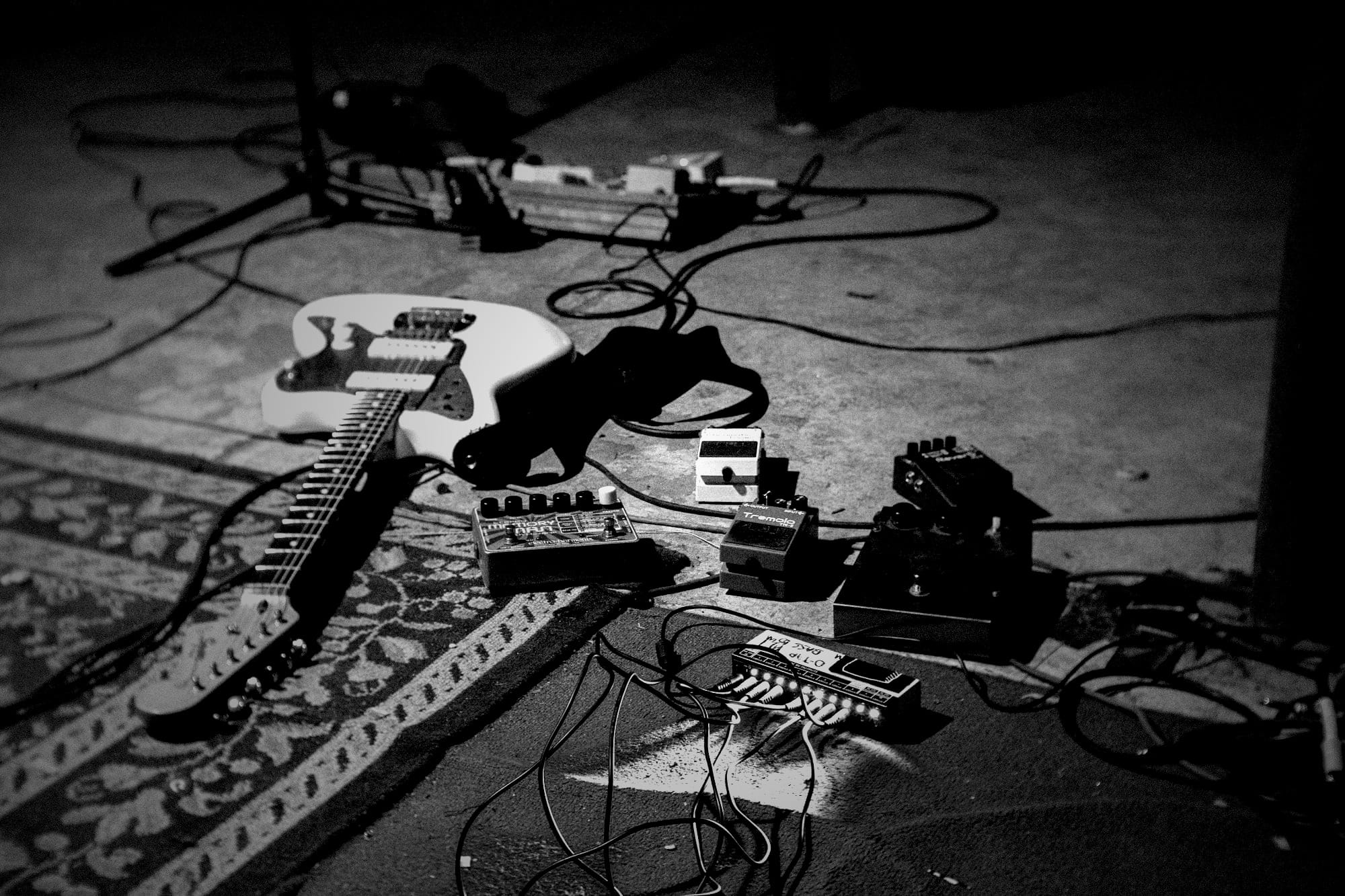 white electric guitar on blue guitar amplifier